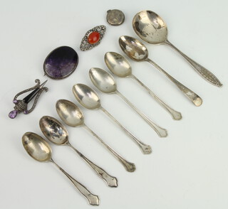 A silver jam spoon Sheffield 1923, minor spoons, 3 brooches and a pendant, gross 135 grams 