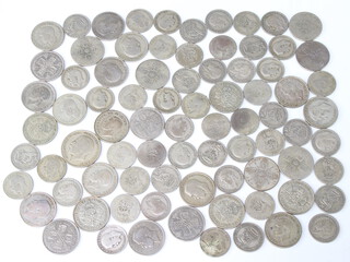 A quantity of pre-1947 silver coins, 610 grams 