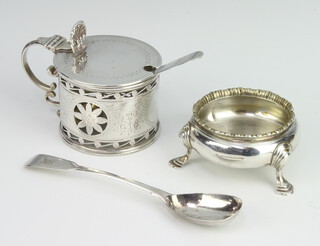 A circular William IV silver salt raised on hoof supports, London 1837 together with a Victorian pierced silver mustard pot London 1876 with an associated mustard spoon and salt spoon, 186 grams 
