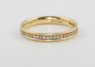 An 18ct yellow gold half eternity ring set diamonds size N, 2.6 grams gross 