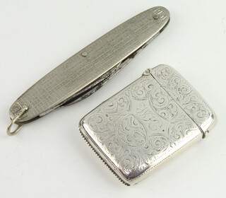 A Victorian engraved silver vesta case Birmingham 1886 20 grams, together with a folding pen knife with 1931 calendar to the grip 