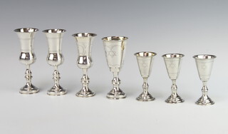 Three silver Kiddush cups Chester 1909 together with 4 others, 256 grams 