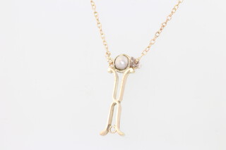 A 9ct yellow gold pearl pendant and chain 1.5 grams