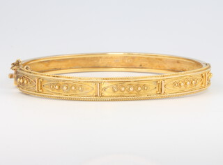 An Edwardian 9ct yellow gold Etruscan style bangle 10 grams