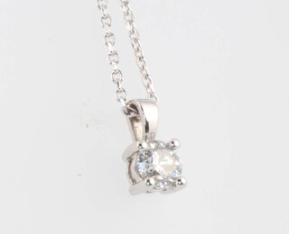 An 18ct white gold brilliant cut diamond pendant and chain, approx. 0.51ct, the chain is 44cm and weighs 3.3 grams together with a WGI certificate 