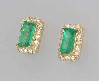 A pair of 18ct yellow gold rectangular emerald and diamond ear studs, emeralds approx. 0.6ct, diamonds 0.3ct, 1.4 grams