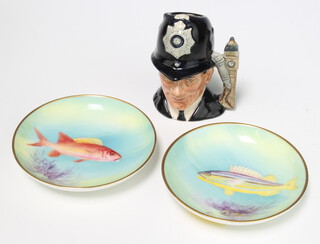Two Royal Worcester dishes decorated fish "Yellow Grunt" 9cm and "Squirrel" 9cm together with a Royal Doulton character jug The London Bobby D6763 8cm 