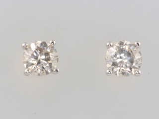 A pair of 18ct white gold single stone diamond ear studs approx. 1.11ct, 2.1 grams