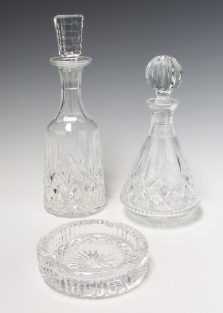 A Waterford Crystal decanter and stopper 32cm, ditto 27cm together with an ashtray 15cm 