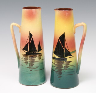 A pair of 1930's Devon Ware jugs decorated with sailing boats 24cm 