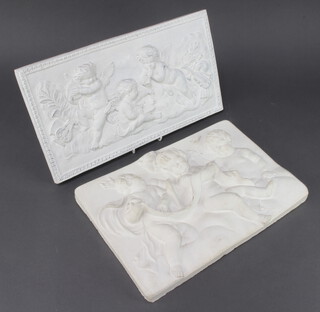 A plaster wall plaque of cavorting cherubs 25cm x 35cm, a ditto 23cm x 41cm 