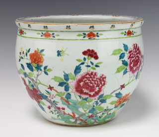 An 18th Century Chinese famille rose jardiniere decorated with flowering peony and insects beneath a formal floral border 31cm 