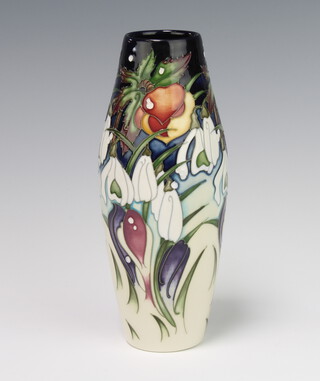 A contemporary Moorcroft Snowtime tapered vase decorated with flowers dated 2010 21cm, boxed 