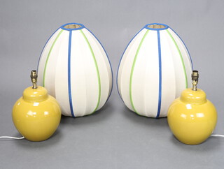 A pair of Celadon green ground table lamps in the form of ginger jars and covers 25cm x 17cm 