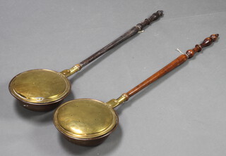 An 18th Century copper warming pan with turned fruitwood  handle and 1 other (2) 