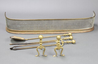 A Victorian pierced brass and steel fender 19cm h x 110cm w x 26cm d together with a pair of brass Adam style fire dogs 20cm h x 12cm w x 16cm d and a 3 piece fireside companion set - poker, shovel and tongs (poker end bent) 