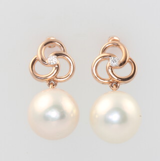 A pair of 9ct rose gold cultured pearl and diamond earrings 4.4 grams, 20mm