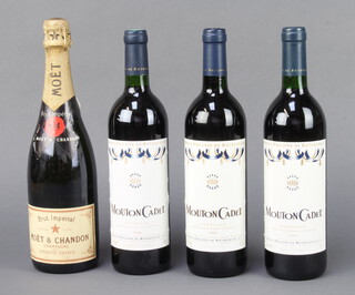 A bottle of Moet & Chandon Champagne together with 3 bottles of 1990, 1998 and 2000 Mouton Cadet Baron Philipe de Rothschild wine