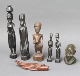 A carved African hardwood figure of a standing lady 33cm x 4cm x 4cm, 4 ditto figures of ladies, carved mask 20cm x 6 and an African hardstone portrait bust of a gentleman 11cm x 4cm x 6cm 