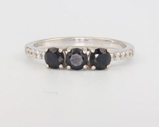 A 9ct white gold 3 stone sapphire ring with diamond shoulders, size N, 2.2 grams  