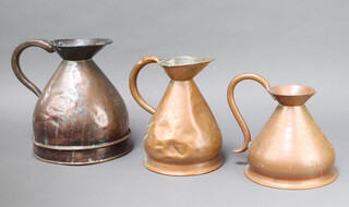 An LCC copper 1 gallon harvest measure, together with 2 half gallon harvest measures (all with dents)