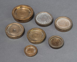 Four 18th Century circular brass weights, 3 marked 1826, all marked AT with City of London crest and Founders Company mark, together with 3 early brass weights