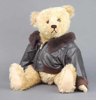 Frances Harper, an Apple of My Eye limited edition bear with articulated limbs, wearing a leather "flying jacket", signed to the paw 51cm 