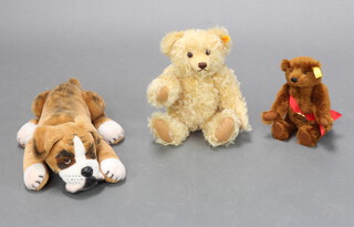 A brown Steiff bear with articulated limbs and bronze badge marked Worlds First Bear 24cm, a yellow Steiff bear with articulated limbs and growler 36cm and a ditto seated Bulldog 40cm  