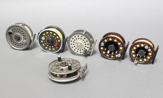 An Abu Fly Max 389 fly fishing reel, a Leeda Concept 395 fly reel, a Martin Mohawk fly reel, and Old Grice & Young reel and 2 others 