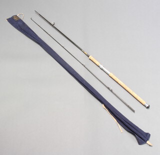 A Hardy Brothers "The Graphite" 8'6" two piece spinning fishing rod in original blue cloth bag 