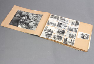 A scrapbook "Horsham Urban and Rural District Civil Defence Corps" containing various black and white photographs and press cuttings
