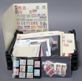 A quantity of various loose world stamps all on paper and first day covers  