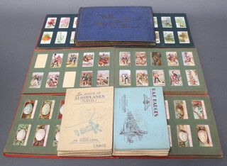 Twelve albums of cigarette cards including Wills (x2), Ogdens, Players (x8) and Gallaghers  