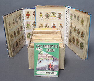 Two albums of silk cigarette cards and a shallow box containing a collection of Players cigarette card albums