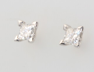 A pair of 18ct white gold princess cut diamond ear studs 0.74ct, 1.2 grams 