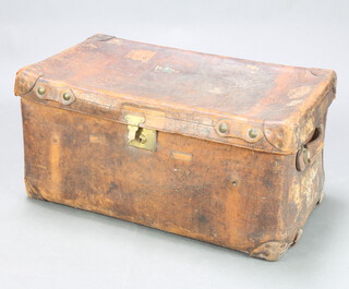 Peal & Co, 487 Oxford Street, London, a 19th Century leather bound trunk with hinged lid 43cm h x 84cm w x 48cm, with numerous labels to the sides, the inner tray is missing and the lock is missing 43cm h x 84cm w x 48cm d