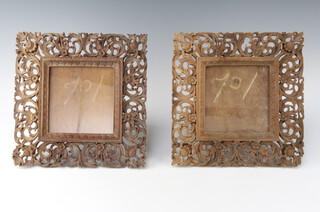 A pair of 19th Century carved and pierced Burmese hardwood easel photograph frames 30cm x 30cm 