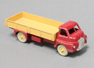 Dinky, a  522 Big Bedford Lorry with maroon cab and fawn trailer and hubs, boxed in blue with orange label.