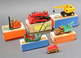 Dinky, a 561 Supertoys Blaw Knox Bulldozer in red with buff box and red label, a 25x Breakdown Lorry in maroon/green with orange box ( rusted winch handle ), a 751 Lawn Mower with blue box, a 14c Coventry Climax forklift in orange box and a 571 Supertoys Coles Mobile Crane