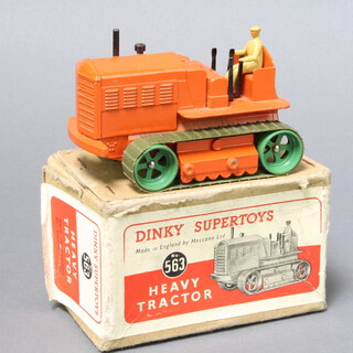Dinky, a 563 Heavy Tractor with tan driver, orange chassis and green tracks. Boxed with top insert and red and white laberl