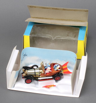 Corgi, a boxed 'Chitty Chitty Bang Bang' car 266 complete with all characters, plastic insert tray and cardboard cloudscape. The pop out wings mechanism is functional