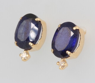 A pair of 18ct yellow gold oval sapphire and diamond ear studs, sapphires approx. 3ct, diamonds 0.06ct, 1.5 grams