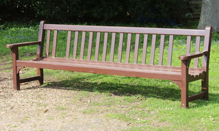 A hardwood slatted garden bench 85cm h x 244cm w 50cm d (missing 2 slats to the back) 