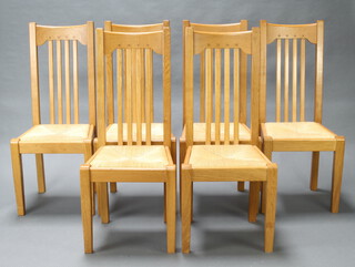 A set of 6 Art Nouveau style light oak stick and rail back dining chairs with woven rush seats 106cm h x 46cm w x 40cm d (seat 35cm x 30cm, there is some wear to the rush in places) 