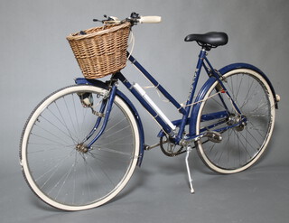 A vintage Raleigh Wayfarer ladies framed bicycle with basket 