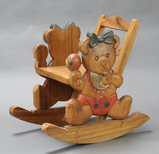 A child's carved hardwood rocking chair decorated teddy bears 64cm h x 46cm w x 68cm d 
