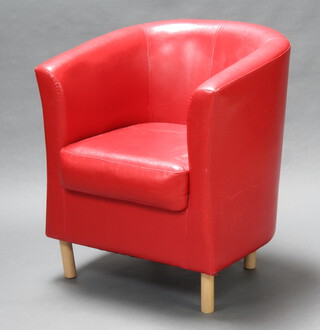 A tub back chair upholstered in red leather effect material 81cm h x 70cm w x 52cm d (seat 48cm x 42cm, slight tear to the right hand arm and some cat scratching to the side)  