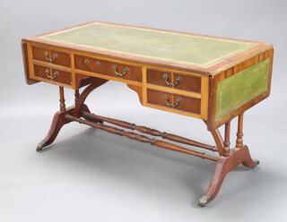 A Georgian style yew drop flap writing table with inset green writing surface fitted 1 long and 2 short drawers 77cm h x 126cm w x 69cm d (some light water damage to the top and drawers are stiff from dampness, centre drawer handle is broken)  