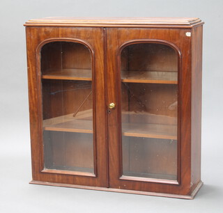 A Victorian mahogany bookcase top fitted shelves enclosed by arched glazed doors 91cm h x 92cm w x 28cm d 