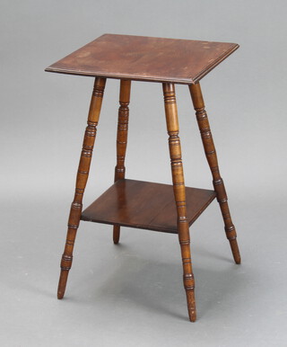 An Edwardian square walnut 2 tier occasional table raised on turned supports 65cm h x 40cm w x 40cm d (some water marks to the top and slight warp) 